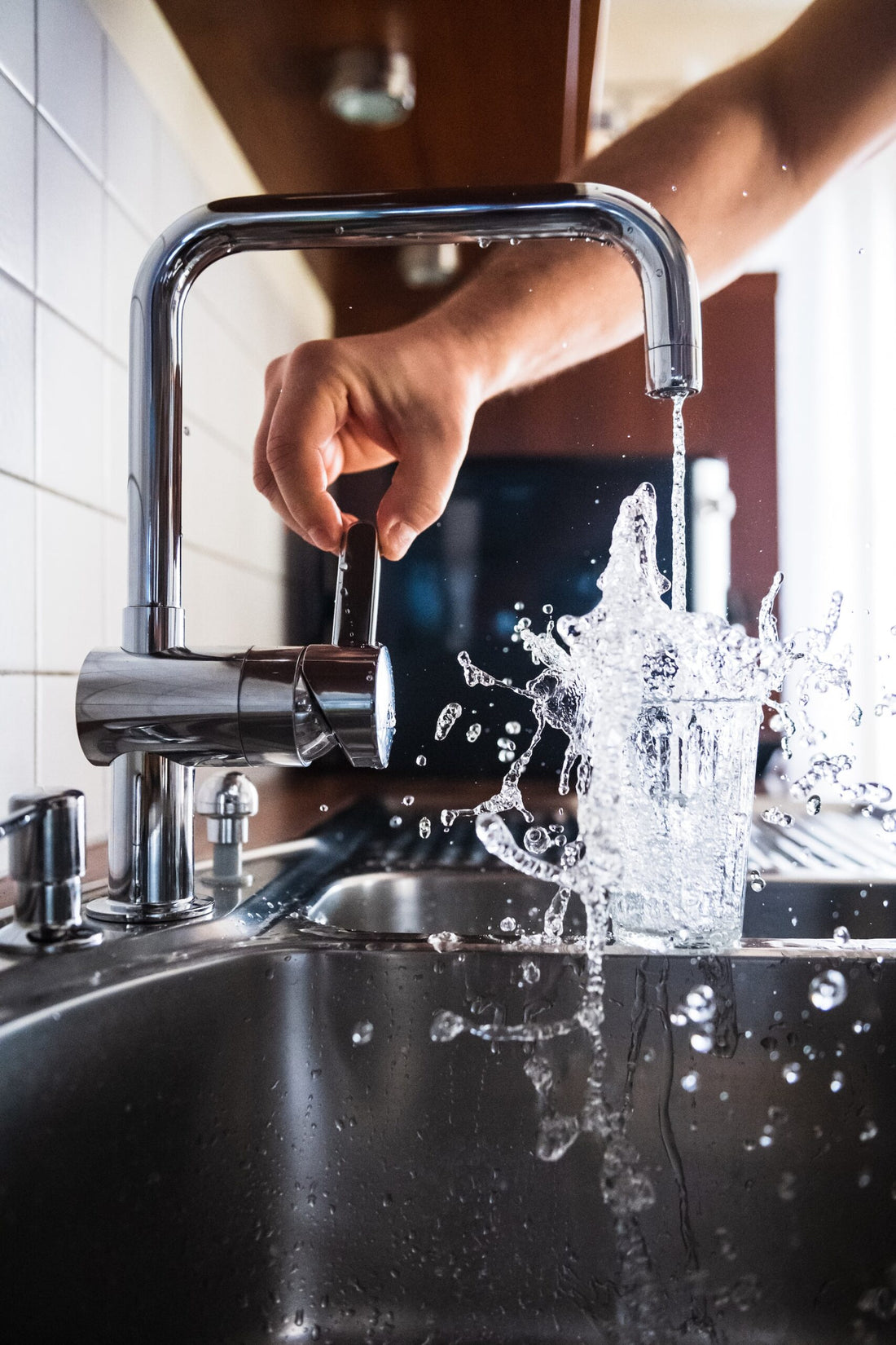 tap water overflowing glass