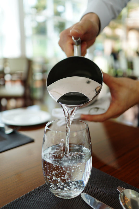 water pouring into a glass
